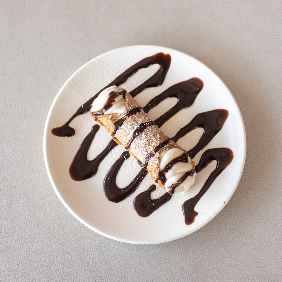 Cannoli with chocolate drizzle